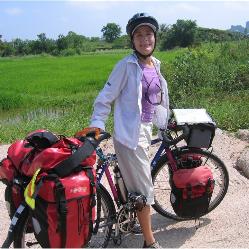 Miriam-Amanda Bejarano-Ligato wearing a Columbia travel shirt while bicycle touring in Thailand